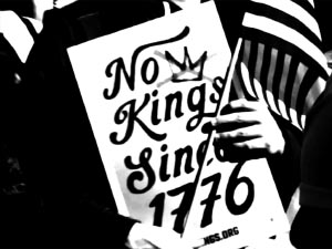 hand holding a poster that reads: No Kings Since 1776