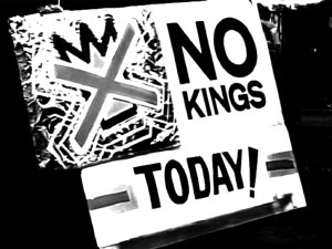 hand holding a poster that reads: No Kings Today